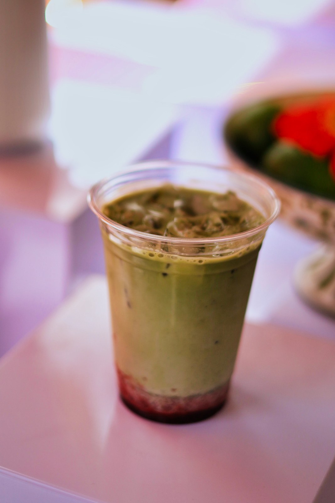 Iced matcha drink with strawberry at Blend and Bliss